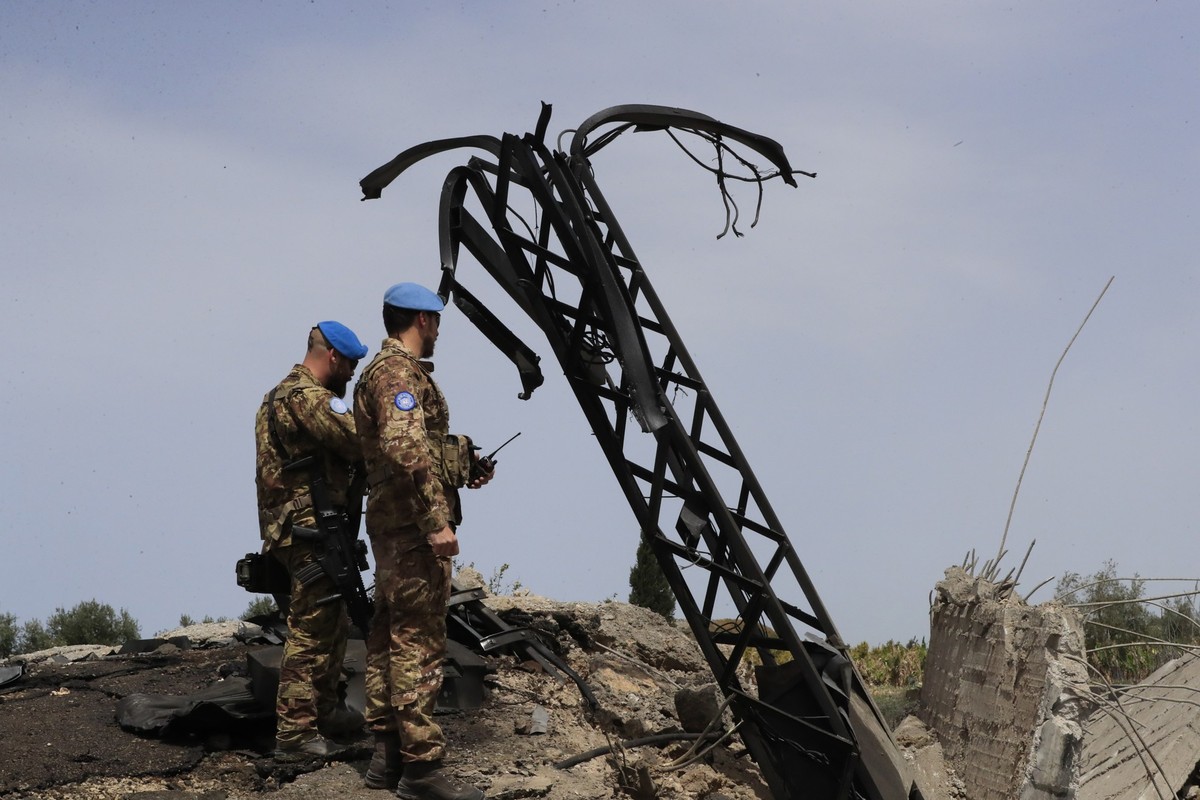 Italian U.N. peacekeeper soldiers inspect a small bridge that was destroyed by an Israeli airstrike, in Maaliya village, south Lebanon, Friday, April 7, 2023. Israel launched rare strikes in southern  ...