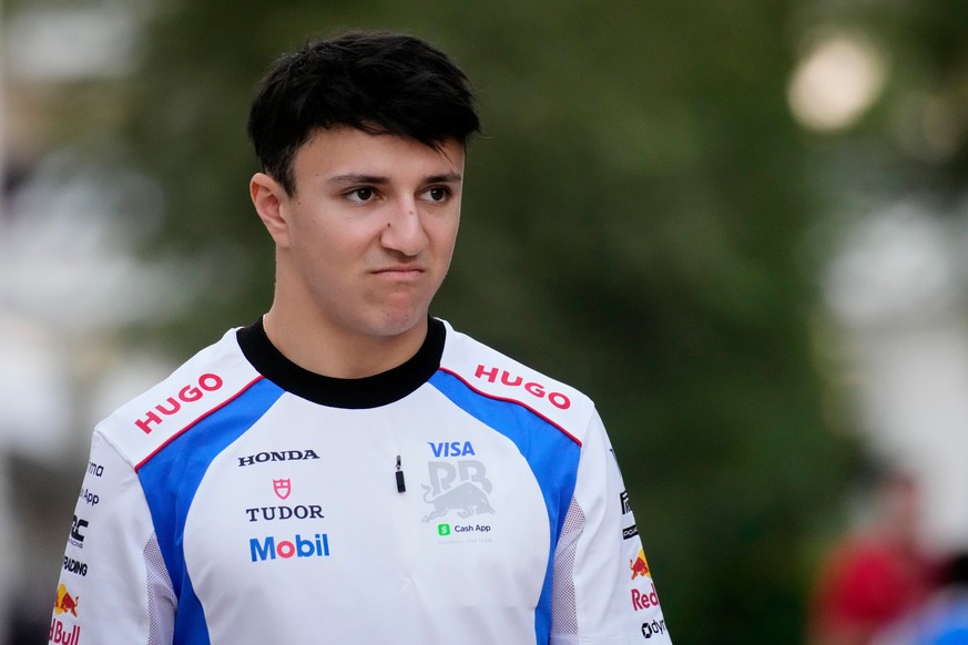 Racing Bulls driver Isack Hadjar of France walks through the paddock at the Lusail International Circuit ahead of the Qatar Formula One Grand Prix, in Lusail, Qatar, Thursday, Nov. 27, 2025. (AP Photo ...