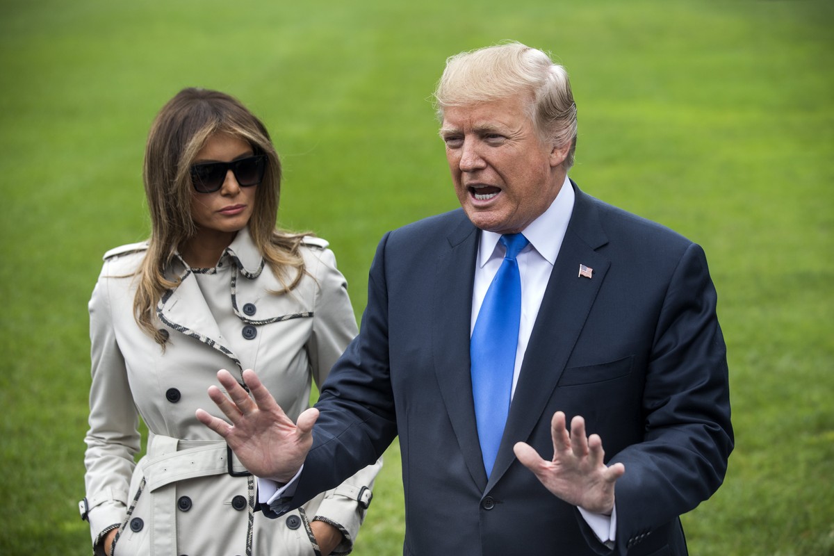 epa06264076 US President Donald J. Trump, standing alongside US First Lady Melania Trump, answers reporter's questions about his decision to withdraw presidential certification of the Iran nuclea ...