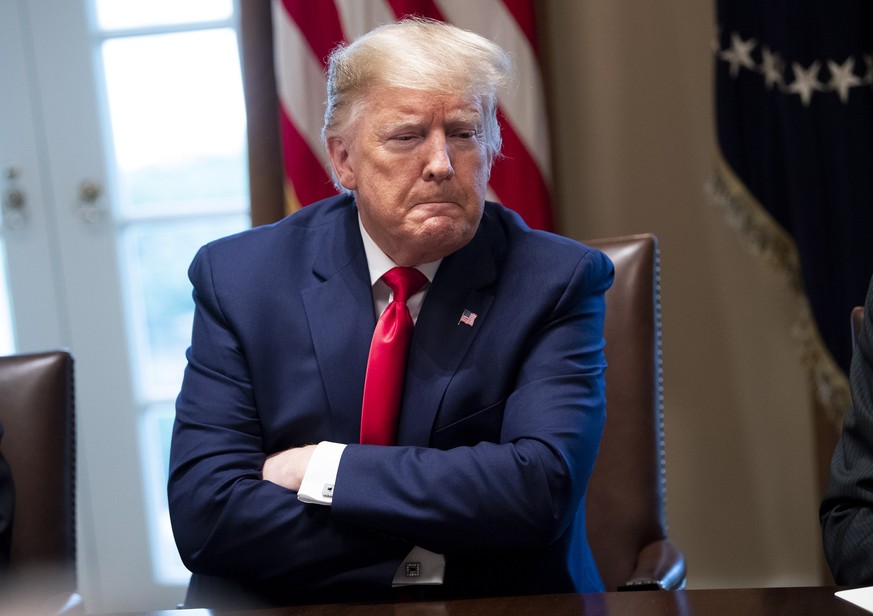 epa08265603 US President Donald J. Trump listens as he meets with the Coronavirus Task Force and pharmaceutical executives, at the White House in Washington, DC, USA, 02 March 2020. The Coronavirus (C ...