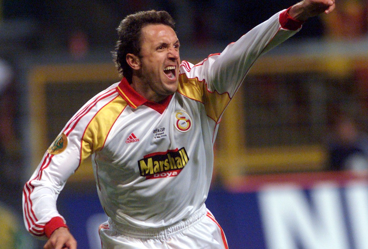 Galatasaray's Romanian player Gheorghe Popescu celebrates after scoring the winning goal, in the penalty shootout in the UEFA cup final match against Arsenal in the Parken stadium in Copenhagen o ...