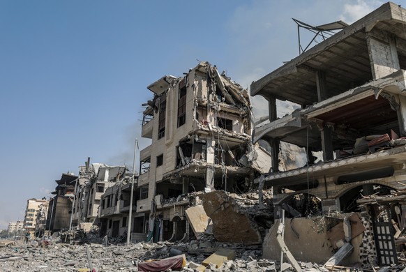 epa10911500 The destroyed Al-Ramal neighborhood after an Israeli airstrike in Gaza City, October 10, 2023. According to the ...
