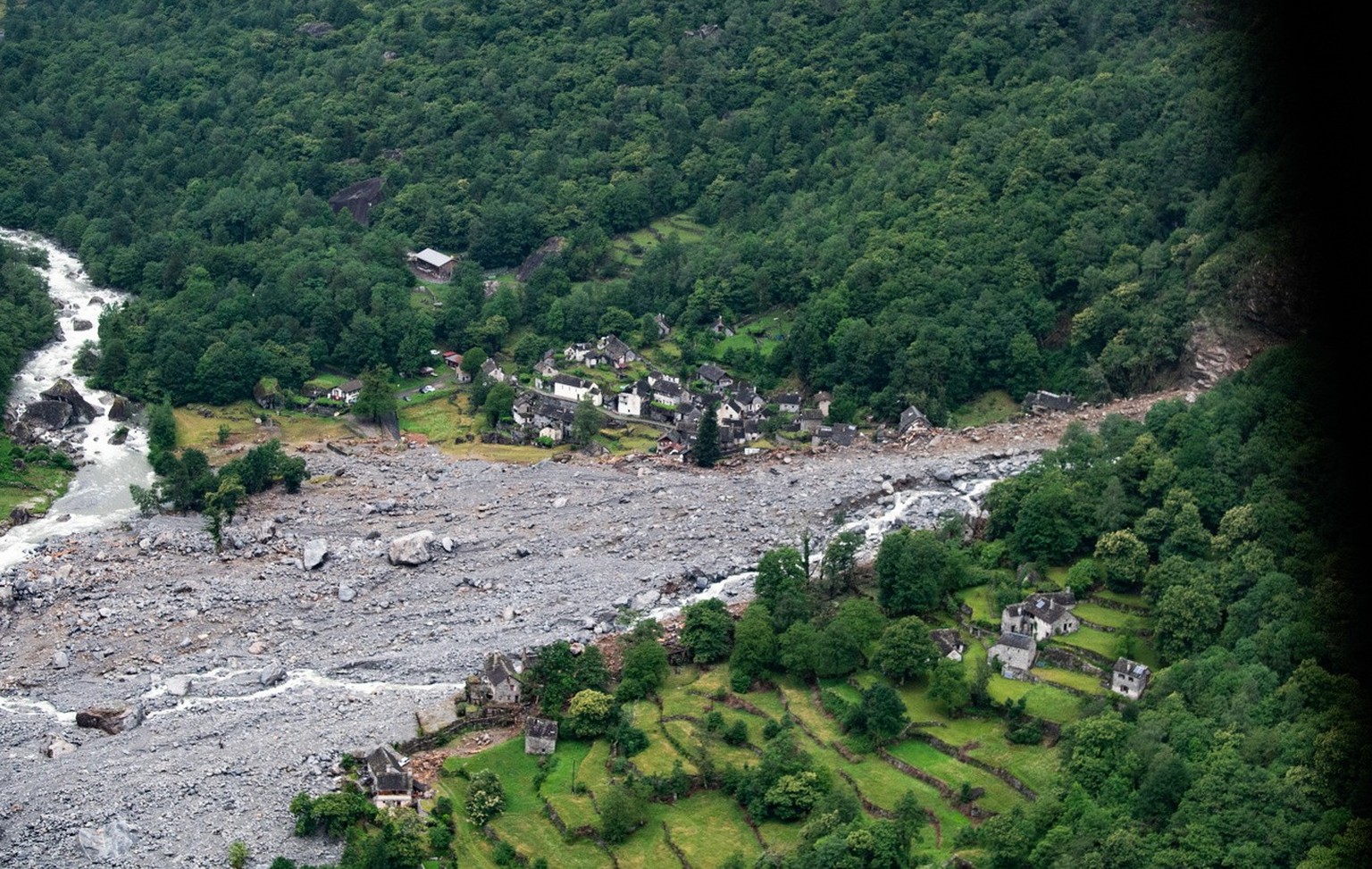 Picture taken from a helicopter of destroyed houses in Fontana, in the Maggia Valley, southern Switzerland on Sunday June 30, 2024. The storm in the night from Saturday to Sunday destroyed various tra ...