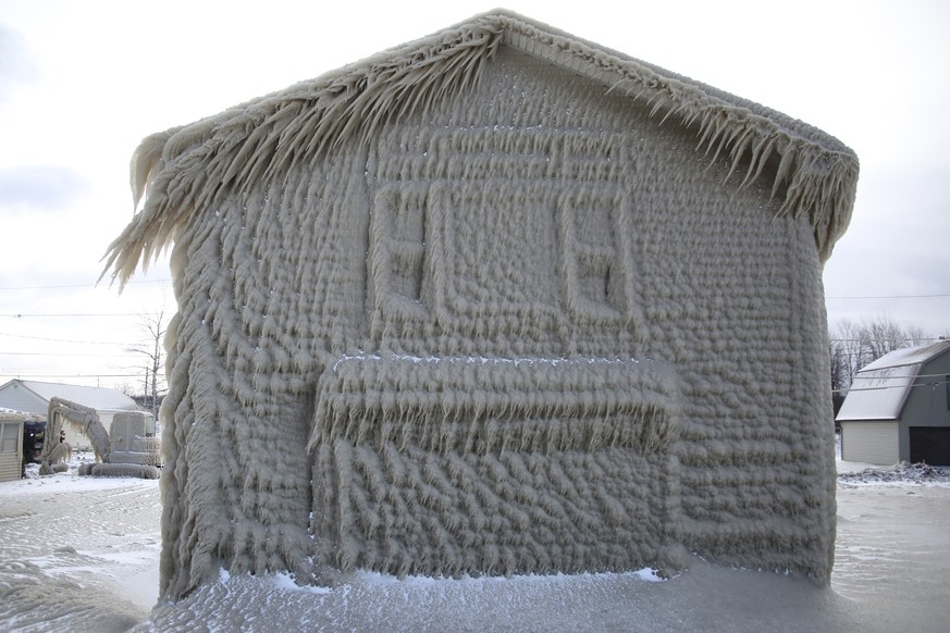 Houses along Hoover Beach is covered by ice from high winds and from the waves from Lake Erie, Saturday, Feb. 29, 2020, in Hamburg N.Y. Blowing snow has fallen around the state since Thursday, though  ...