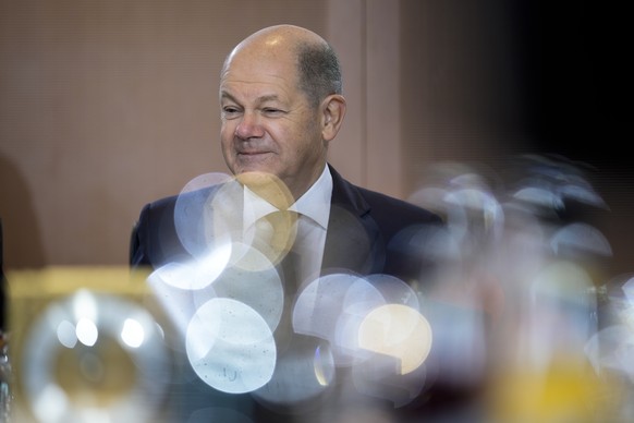 German Chancellor Olaf Scholz arrives for the last regular cabinet meeting of the German government in 2022 at the chancellery in Berlin, Germany, Wednesday, Dec. 21, 2022. (AP Photo/Markus Schreiber)