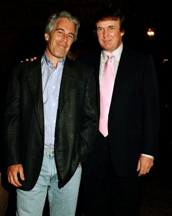 Portrait of American financier Jeffrey Epstein (left) and real estate developer Donald Trump as they pose together at the Mar-a-Lago estate, Palm Beach, Florida, 1997. (Photo by Davidoff Studios/Getty ...