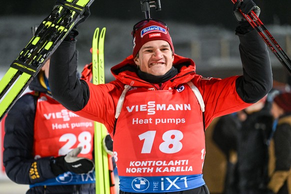 epa10336355 Niklas Hartweg of Switzerland celebrates in the finish area after taking the second place in the men's 20km Individual race of the IBU Biathlon World Cup in Kontiolahti, Finland, 29 Novemb ...