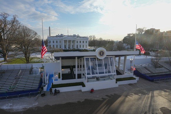 Workers continue with the finishing touches on the presidential reviewing stand on Pennsylvania outside the White House Thursday, Jan. 16, 2025, in Washington, ahead of President-elect Donald Trump&#0 ...