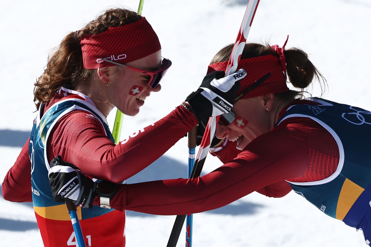 epa12753191 Nadine Faehndrich (R) of Switzerland and Nadja Kaelin of Switzerland react in the finish area during the Women's Team Sprint Free of the Cross-Country Skiing competitions at the Milan ...