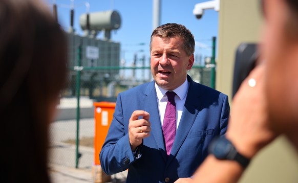 epa13166563 Sven Schulze (CDU), Minister-President of Saxony-Anhalt, gives an interview during the inauguration of a battery storage facility operated by energy company Muench Energie in Merseburg, Ge ...