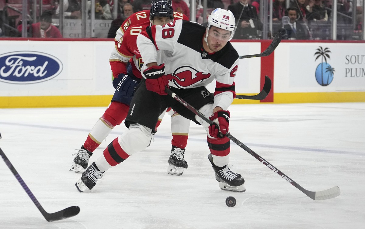 New Jersey Devils right wing Timo Meier (28) skates with the puck during the first period of an NHL hockey game against the Florida Panthers, Wednesday, Nov. 12, 2025, in Sunrise, Fla. (AP Photo/Lynne ...
