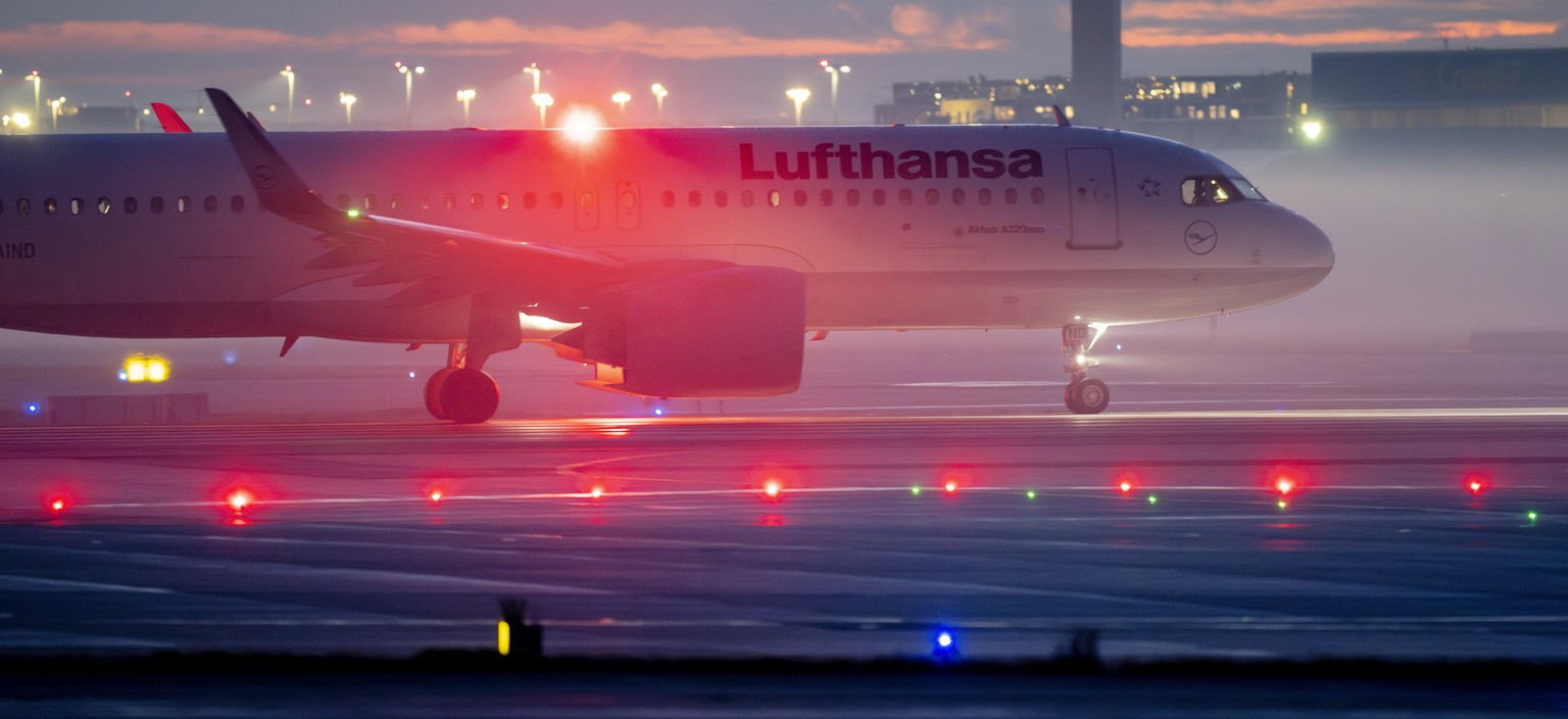 An aircraft rolls to the starting position at the airport in Frankfurt, Germany, on a hazy Wednesday morning, Jan. 31, 2024. The security staff of most German airports announced a one day lasting stri ...