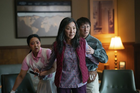 This image released by A24 Films shows, from left, Stephanie Hsu, Michelle Yeoh and Ke Huy Quan in a scene from, &quot;Everything Everywhere All At Once.&quot; (Allyson Riggs/A24 Films via AP)