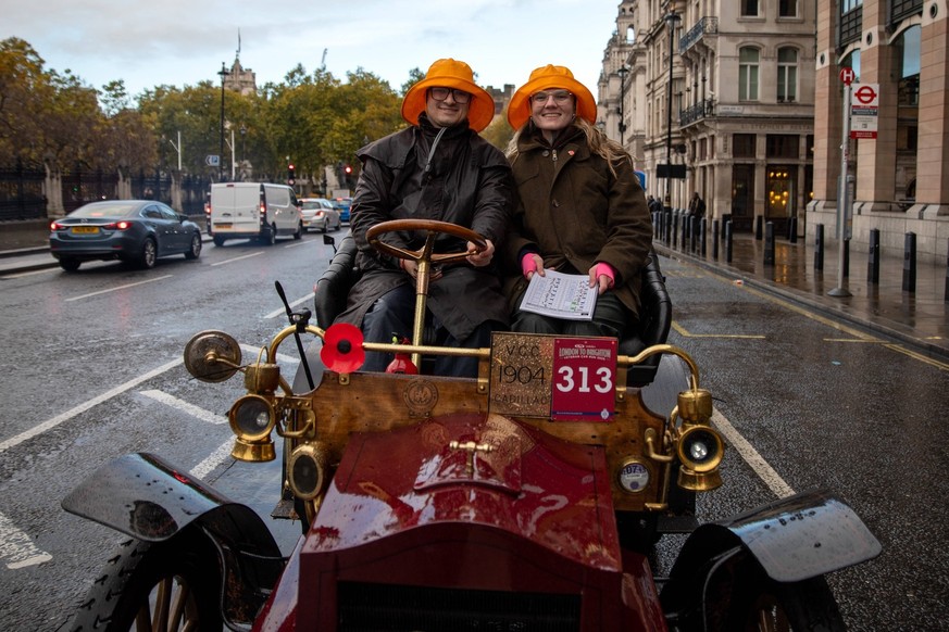 RAC London to Brighton Veteran Car Run - 02 Nov 2025 The driver and the passenger of a veteran car pose whilst siting in traffic. The annual RAC London to Brighton Veteran Car Run, founded in 1896, is ...