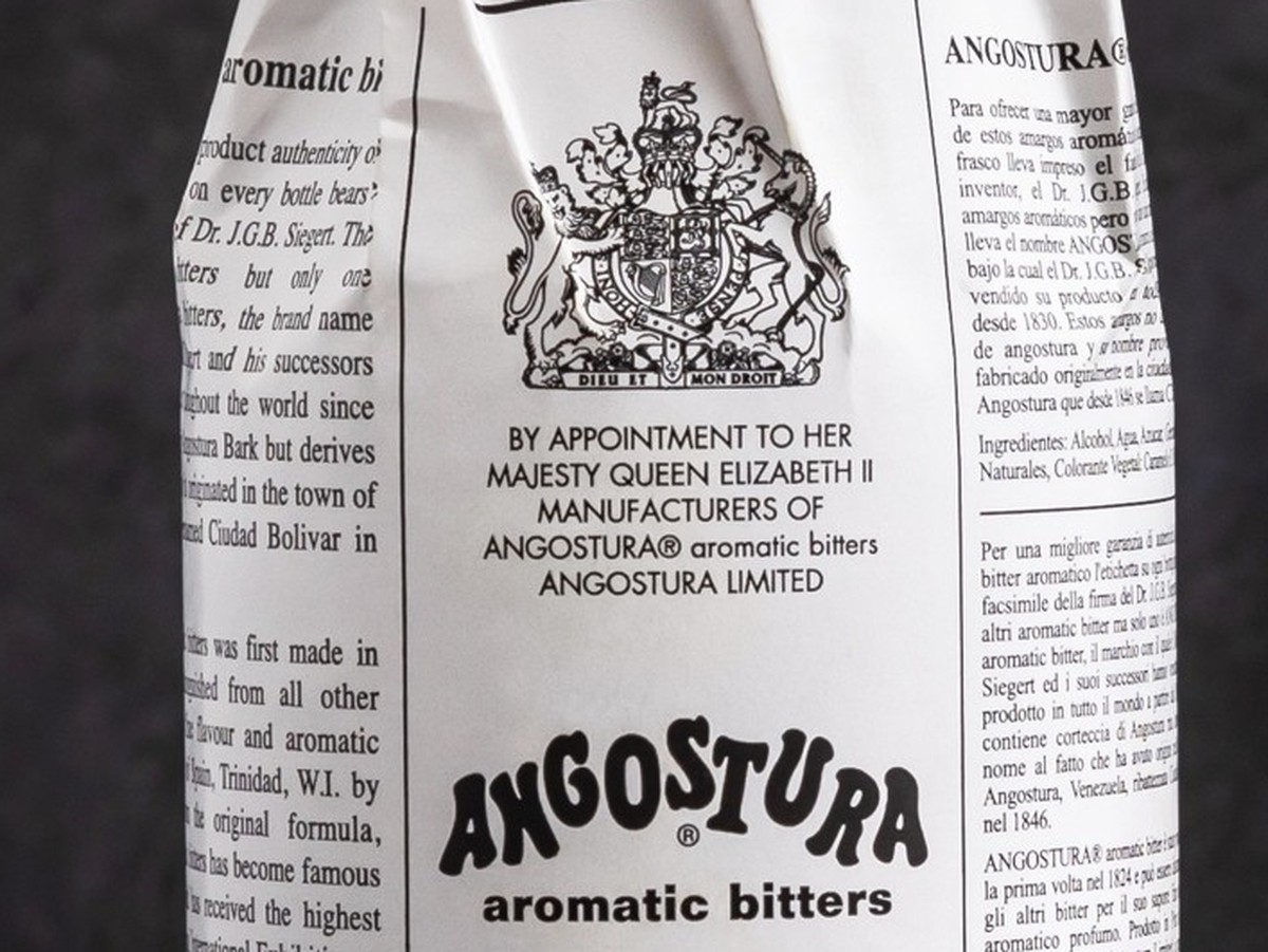 Minsk, Belarus - 14-04-2023: a bottle of Angostura Aromatic Bitters and Angostura Orange Bitters on dark background