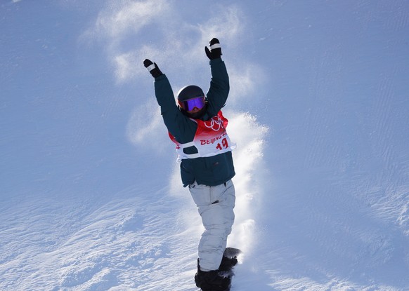 epa09729036 Ariane Burri of Switzerland in action during Women&#039;s Snowboard Slopestyle qualification at the Zhangjiakou Genting Snow Park at the Beijing 2022 Olympic Games, Beijing municipality, C ...