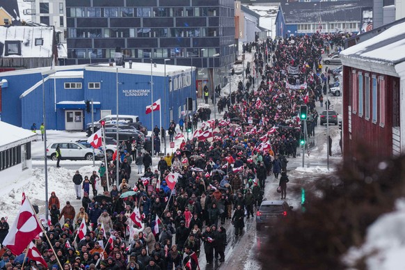 FILE - A crowd walks to the U.S. Consulate to protest against President Trump's policy towards Greenland, Saturday, Jan. 17, 2026, in Nuuk, Greenland. (AP Photo/Evgeniy Maloletka, File)
Denmark E ...