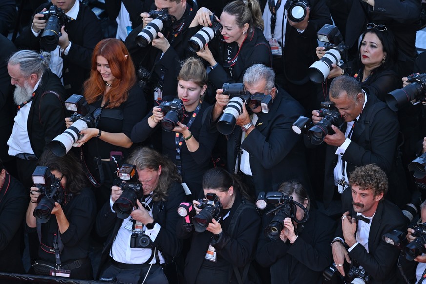 epa12951807 Photographers at work during the premiere of 'The Electric Kiss' (La Venus Electrique) and opening ceremony of the 79th annual Cannes Film Festival, in Cannes, France, 12 May 202 ...