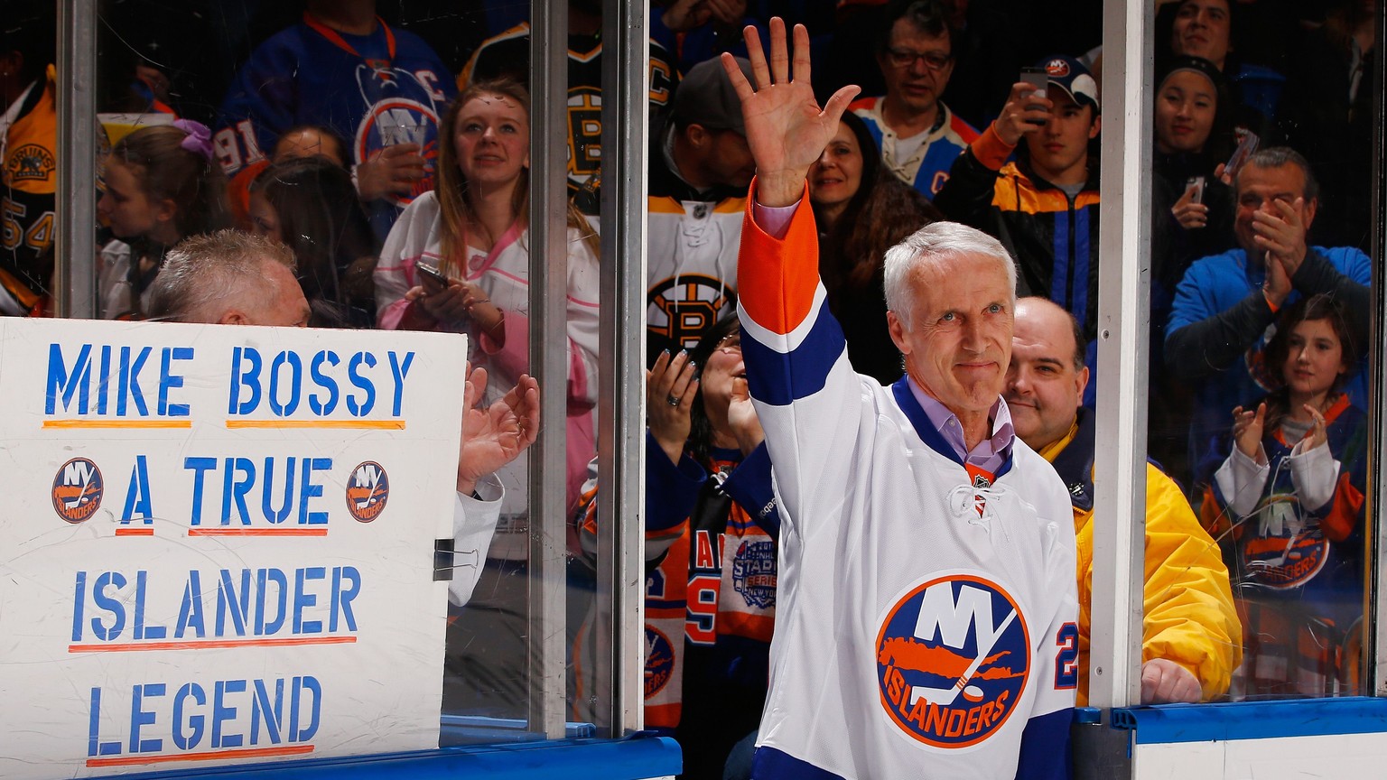 UNIONDALE, NY - JANUARY 29: Former New York Islandes Mike Bossy waves to the crowd prior to the game duing Mike Bossy tribute Night at the Nassau Veterans Memorial Coliseum on January 29, 2015 in Unio ...