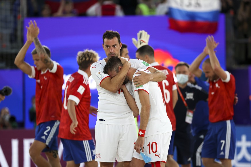 Switzerland team players react after after losing the FIFA World Beach Soccer Championship semifinal game between Football Union Of Russia, RFU and Switzerland in Moscow, Russia, Saturday, Aug. 28, 20 ...