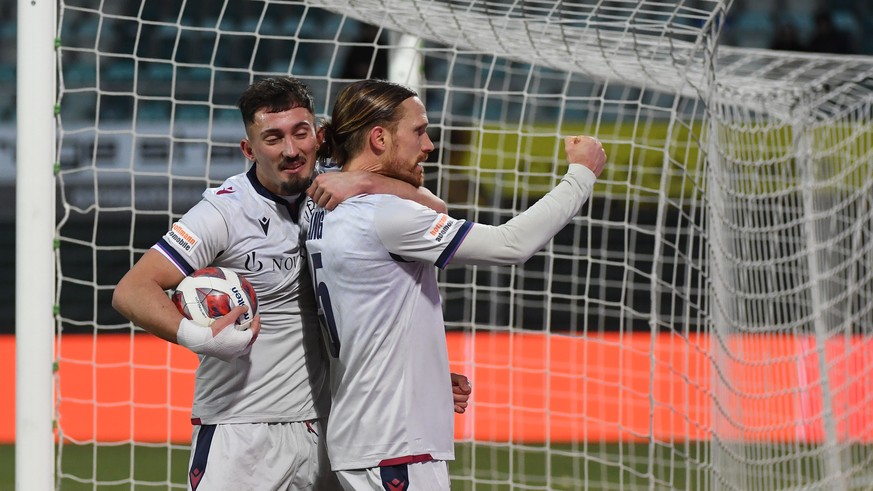 Basel&#039;s player Andi Zeqiri and Basel&#039;s player Michael Lang, right, celebrate the 2-2 goal, during the Super League soccer match FC Lugano against Basel FC, at the Cornaredo stadium in Lugano ...