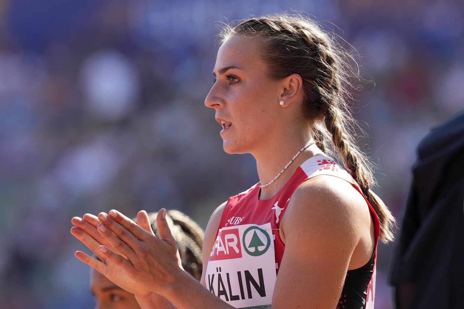 Annik Kalin, of Switzerland, reacts after winning a Women's heptathlon 100 meters hurdles heat during the athletics competition in the Olympic Stadium at the European Championships in Munich, Germany, ...