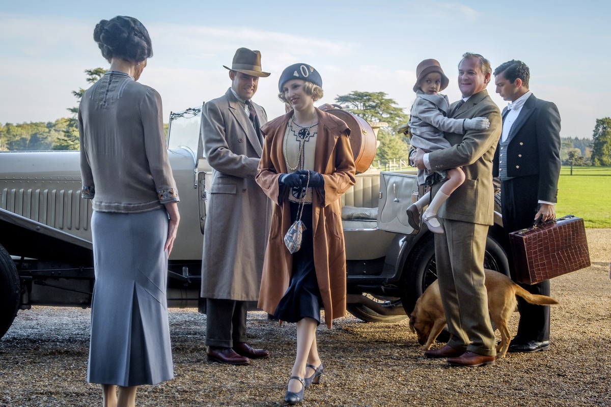 This image released by Focus features shows Elizabeth McGovern, from left, Harry Hadden-Paton, Laura Carmichael, Hugh Bonneville and Michael Fox, right, in a scene from "Downton Abbey." The  ...