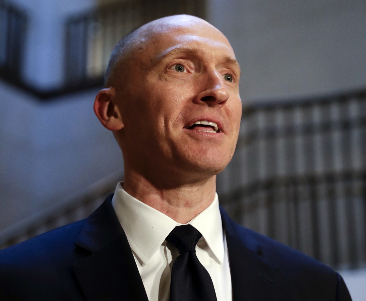 In this Nov. 2, 2017, photo, Carter Page, a foreign policy adviser to Donald Trump's 2016 presidential campaign, speaks with reporters following a day of questions from the House Intelligence Com ...