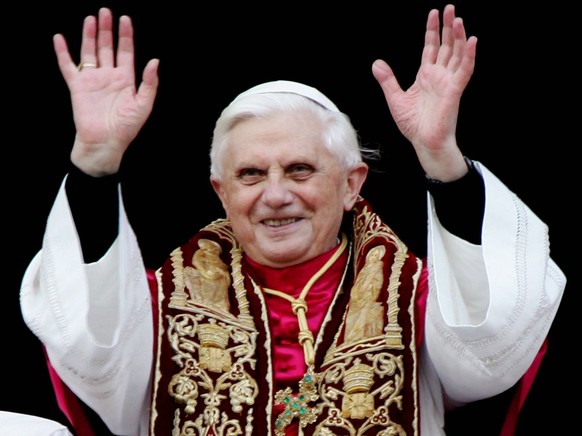 A photograph dated 19 April 2005 showing the newly elected Pope Benedict XVI as he greets pilgrims while standing on the balcony of Saint Peter&#039;s Basilica, in the Vatican, after his election. Car ...