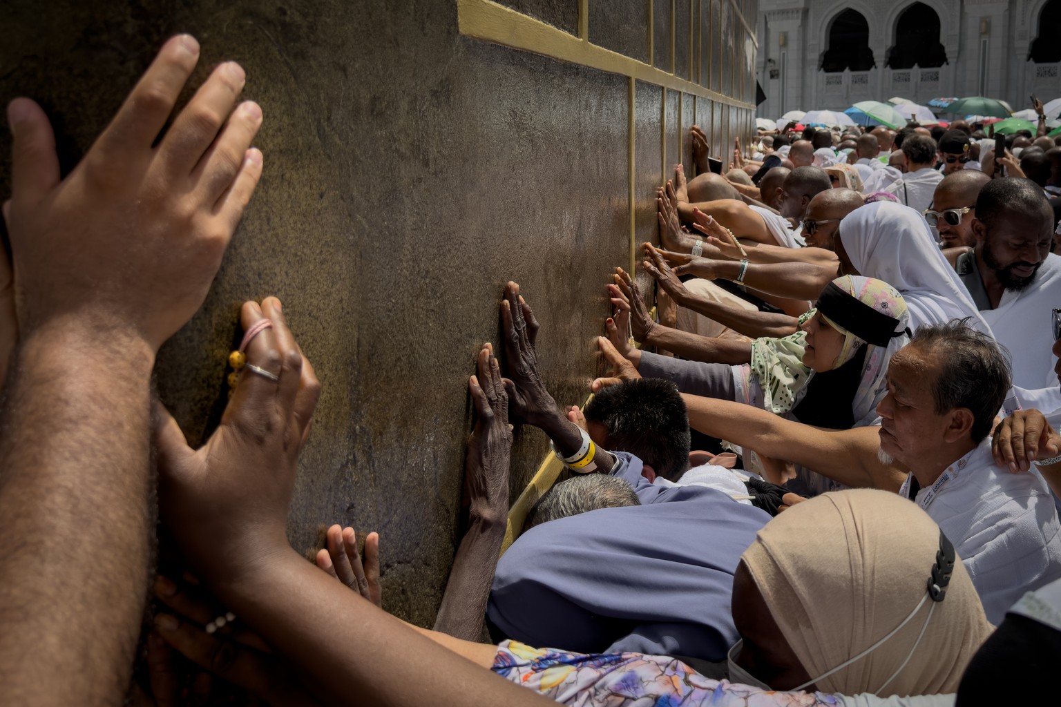 Muslim pilgrims touch the walls of the Kaaba, the cubic building at the Grand Mosque, during the annual Hajj pilgrimage, in Mecca, Saudi Arabia, Thursday, May 21, 2026. (AP Photo/Altaf Qadri)
APTOPIX  ...