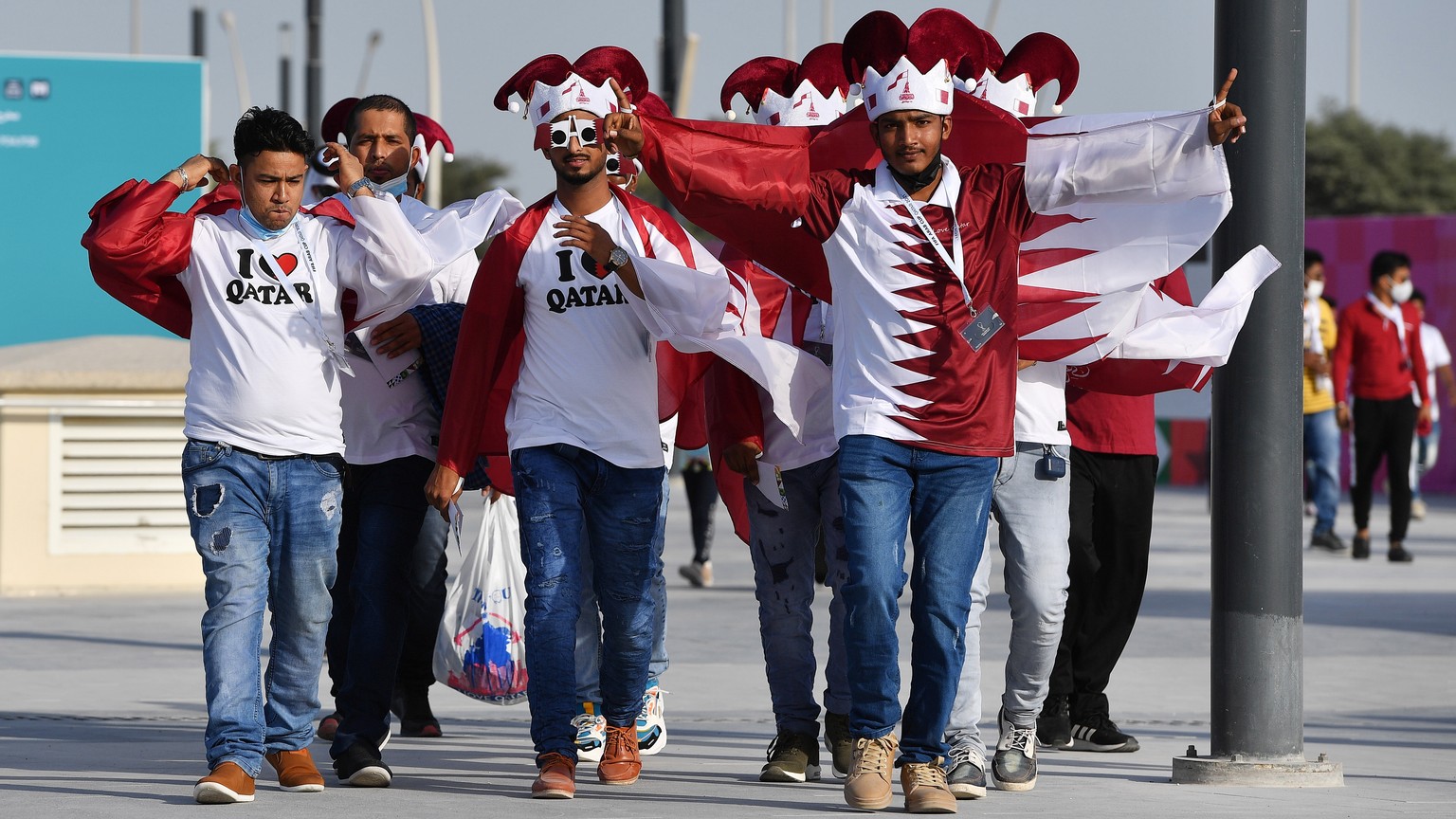 epa09618766 Fans arrive to the Education City Stadium for the FIFA Arab Cup group A soccer match between Oman and Qatar in Al-Rayyan, Qatar, 03 December 2021. EPA/Noushad Thekkayil