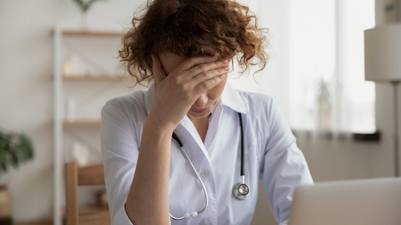 Exhausted tired doctor symbol image