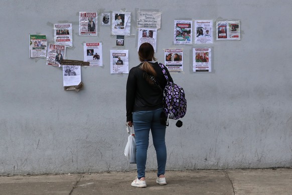 epa13073525 A person checks missing persons posters outside the Domingo Luciani hospital in Caracas, Venezuela, 29 June 2026, as search-and-rescue operations continue after the earthquakes. EPA/RAUL M ...