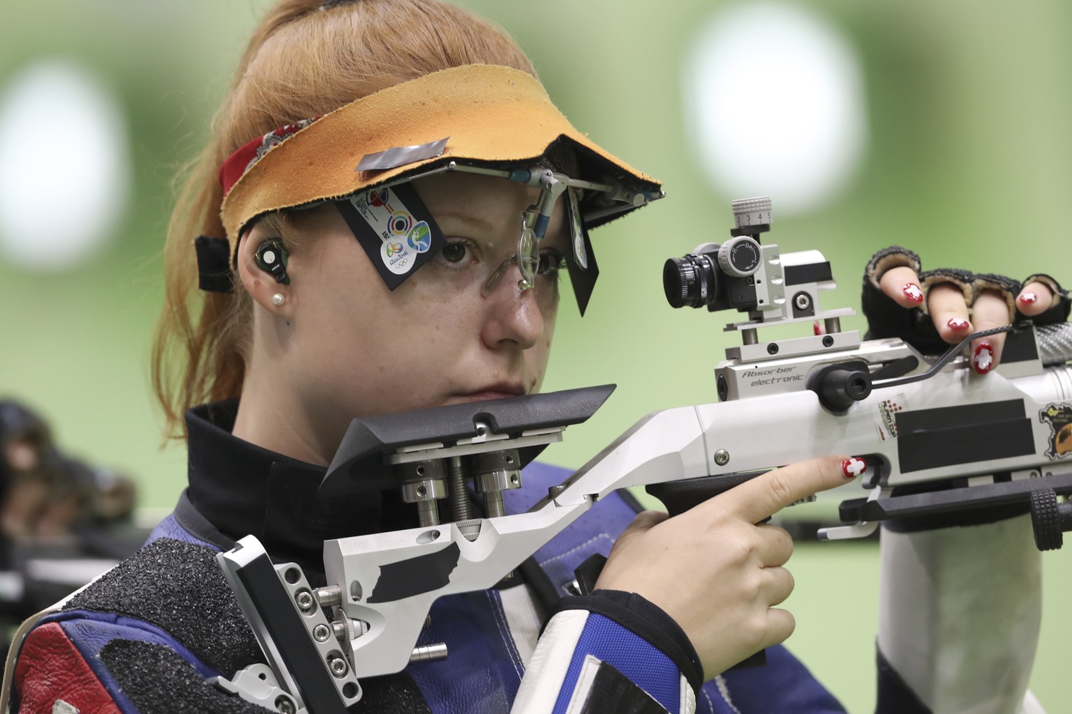 Nina Christen of Switzerland competes during the Women&#039;s 10m Air Rifle qualification at Olympic Shooting Center at the 2016 Summer Olympics in Rio de Janeiro, Brazil, Saturday, Aug. 6, 2016. (AP  ...