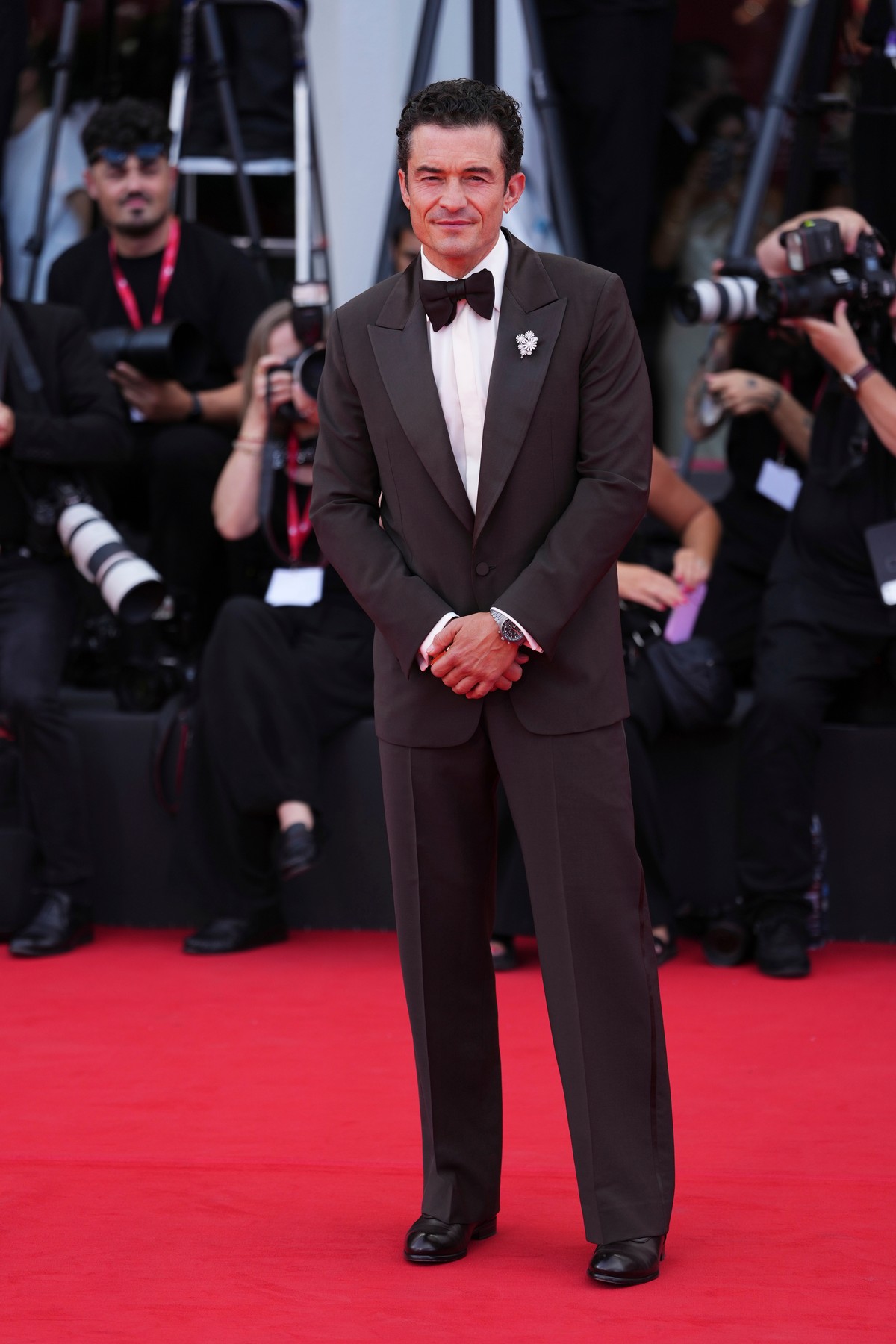 Orlando Bloom poses for photographers at the red carpet for the film 'Bucking Fastard' during the 83rd edition of the Venice Film Festival in Venice, Italy, on Thursday, Sept. 3, 2026. (Phot ...