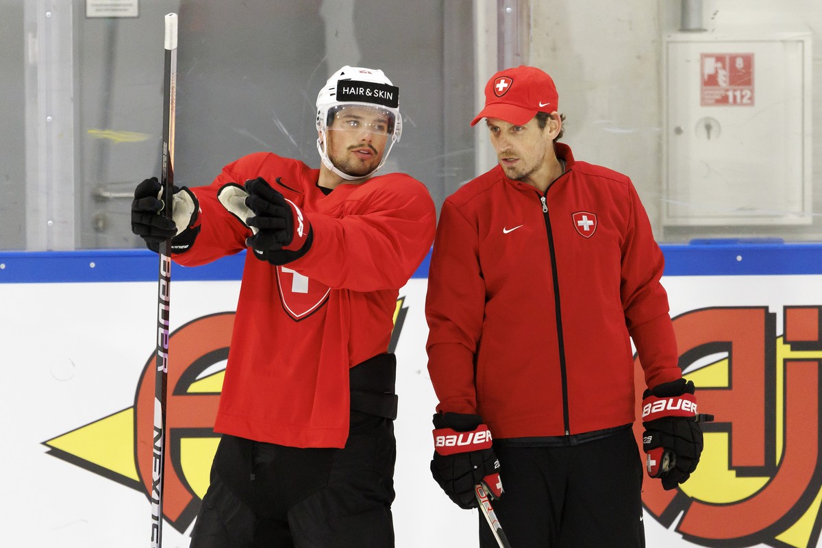 Switzerland's forward Kevin Fiala, left, talks with Patrick Fischer, head coach of Switzerland national ice hockey team, during a Switzerland team training session at the IIHF 2023 World Champion ...