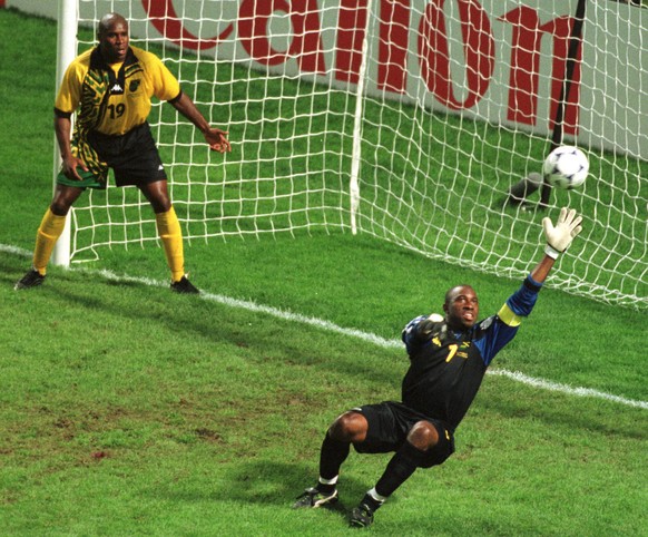 Jamaica&#039;s Frank Sinclair, left, looks on as goalkeeper Warren Barrett fails to stop a scoring shot from Croatia&#039;s Davor Suker in the soccer World Cup 98 group H match between Jamaica and Cro ...