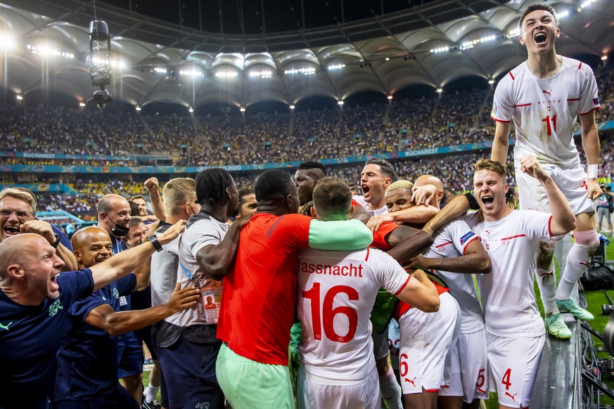Switzerland's soccer players celebrate after winning the Euro 2020 soccer tournament round of 16 match between France and Switzerland at the National Arena stadium, in Bucharest, Romania, Monday, ...