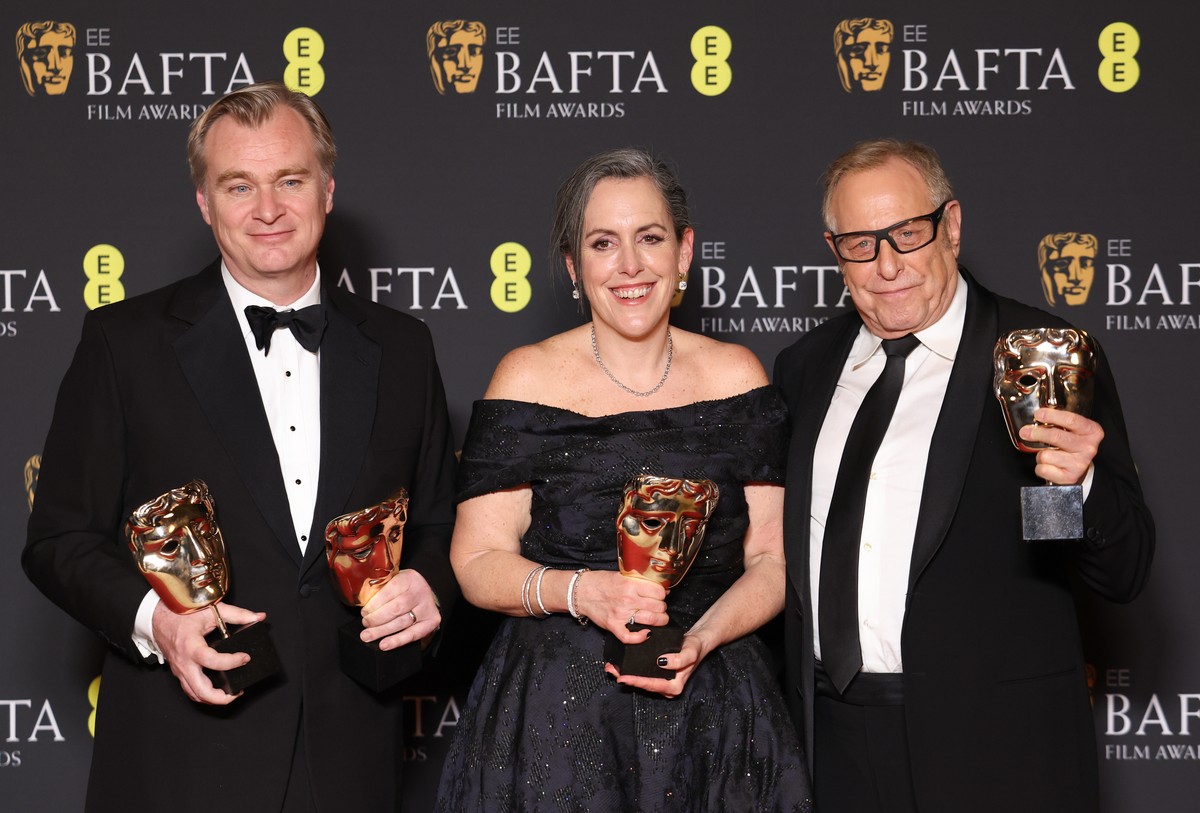 epa11165109 Christopher Nolan, Emma Thomas and Charles Roven after winning the Best Director and Best Film awards for Oppenheimer in the press room during the BAFTA Film Awards at the Royal Festival H ...
