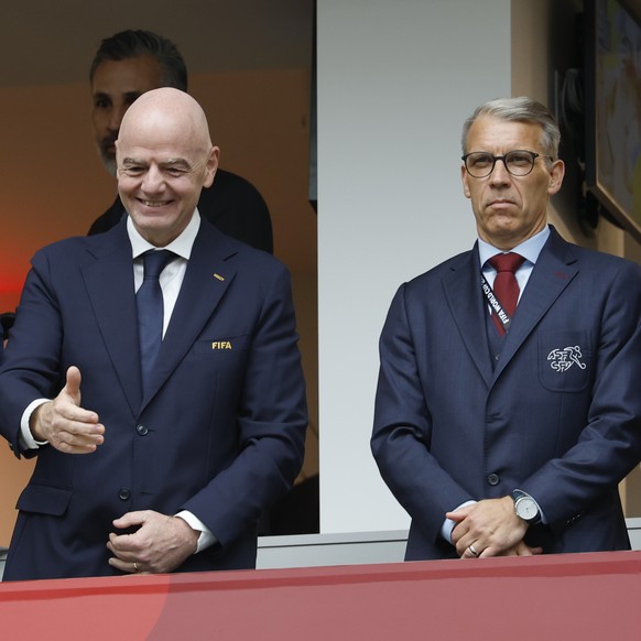 FIFA President Gianni Infantino, middle, gestures next to Peter Knaebel, President of the Swiss Football Assosiation, right, and Ramon Jesurun, President Colombia Football Federation, right, during th ...