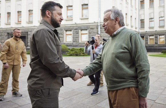 In this image provided by the Ukrainian Presidential Press Office, Ukrainian President Volodymyr Zelenskyy and U.N. Secretary-General Antonio Guterres, right, shake hands during their meeting in Kyiv, ...