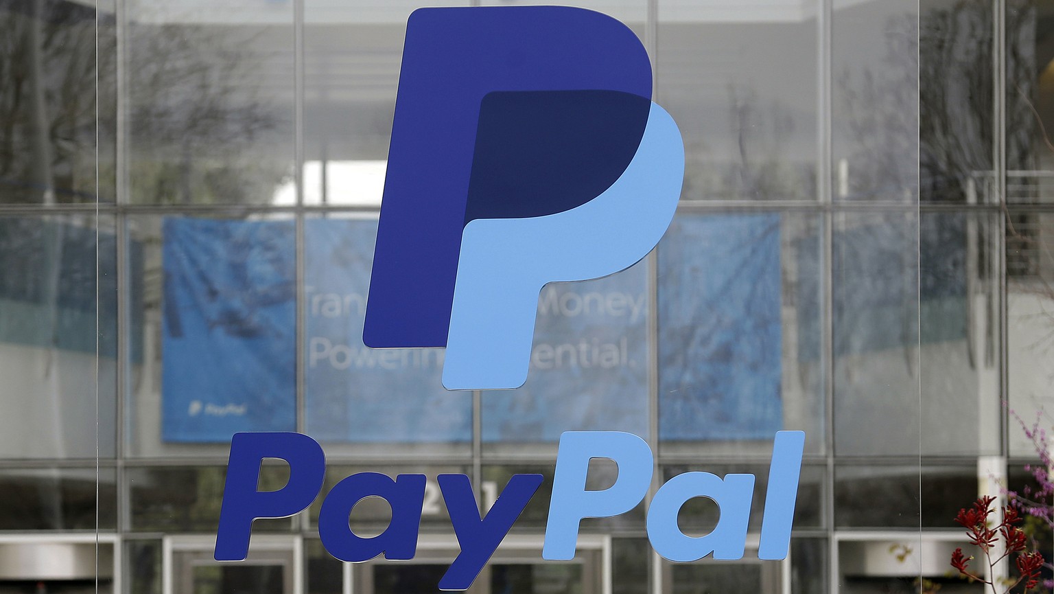 FILE - The PayPal logo hangs displayed outside their company headquarters on March 10, 2015, in San Jose, Calif. Intuit executive Alex Chriss will become the president and CEO of digital payments comp ...