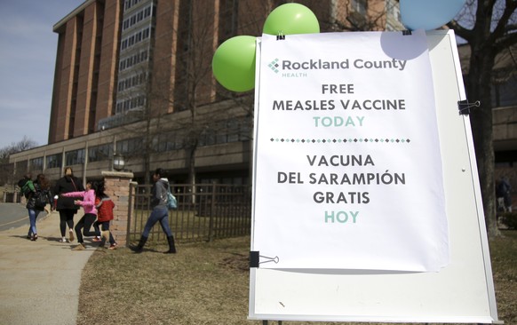 A sign advertising free measles vaccines is displayed at the Rockland County Health Department in Pomona, N.Y., Wednesday, March 27, 2019. The county in New York City&#039;s northern suburbs declared  ...