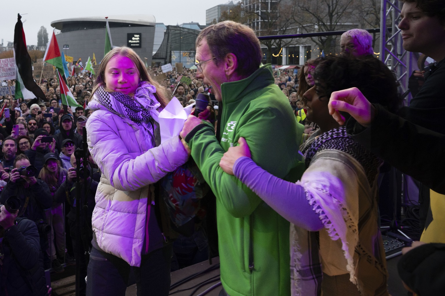 Climate activist Greta Thunberg is interrupted by a climate activist after Thunberg expressed solidarity with the Palestinians as tens of thousands of people marched through Amsterdam, Netherlands, Su ...