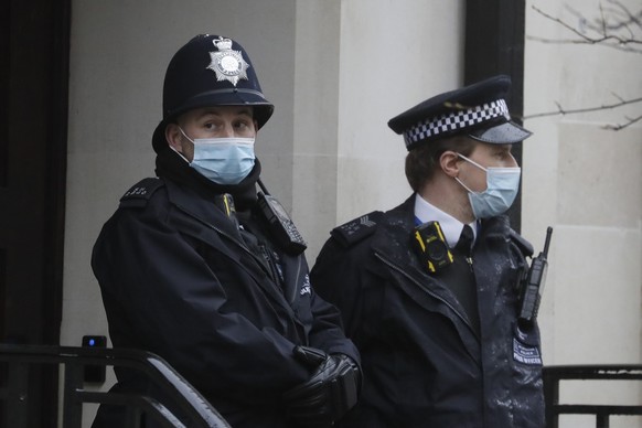 Police officers stand outside King Edward VII&#039;s hospital in London, Wednesday, Feb. 17, 2021. Buckingham Palace says 99-year-old Prince Philip has been admitted to a London hospital after feeling ...