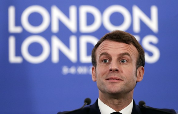 epa08044235 French President Emmanuel Macron gives a press conference at the end of NATO Summit in London, Britain, 04 December 2019. NATO countries&#039; heads of states and governments gather in Lon ...