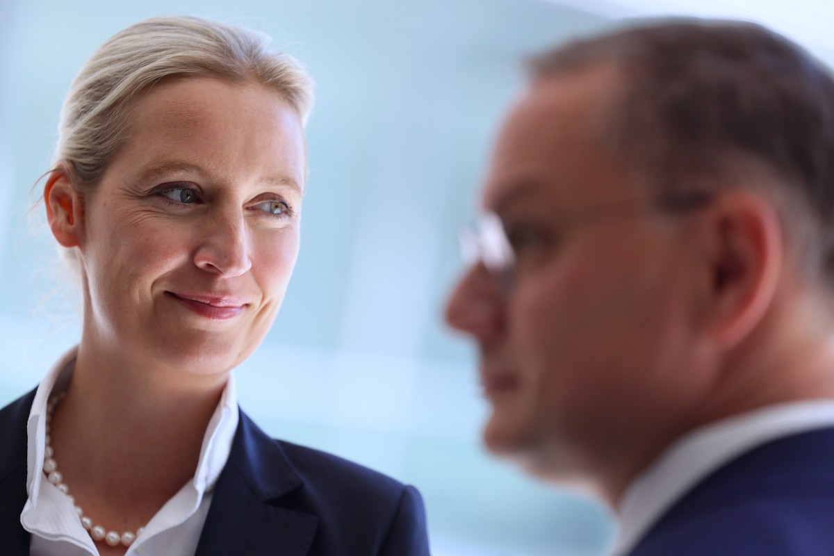 epa12096576 Alternative for Germany (AfD) party and faction co-chairs Alice Weidel (L) and Tino Chrupalla wait before a news conference prior to a faction meeting at the German Bundestag (Parliament)  ...
