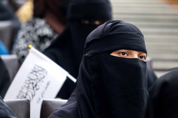 epa09461019 Afghan students listen to women speakers prior to their pro-Taliban rally outside the Shaheed Rabbani Education University in Kabul, Afghanistan, 11 September 2021. The United States envoy ...