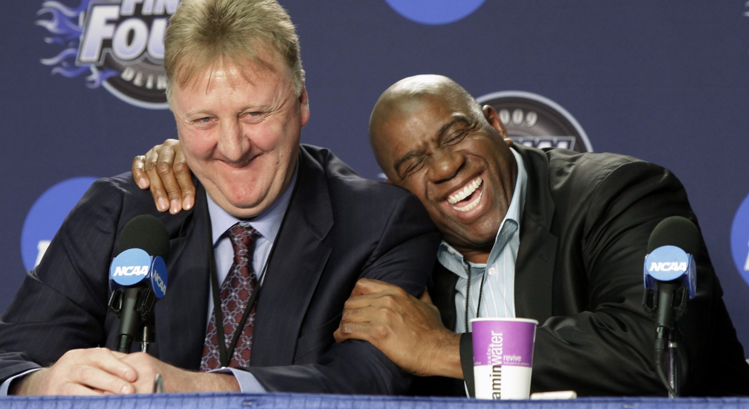 FILE - In this April 6, 2009, file photo, former NBA players Larry Bird, left, and Earvin &quot;Magic&quot; Johnson share a laugh at a news conference before the championship game between Michigan Sta ...