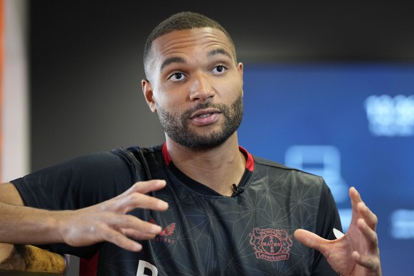Bayer Leverkusen defender Jonathan Tah talks to The Associated Press during an interview at the BayArena in Leverkusen, Germany, Wednesday, April 24, 2024. Tah won the Bundesliga title already, and ha ...